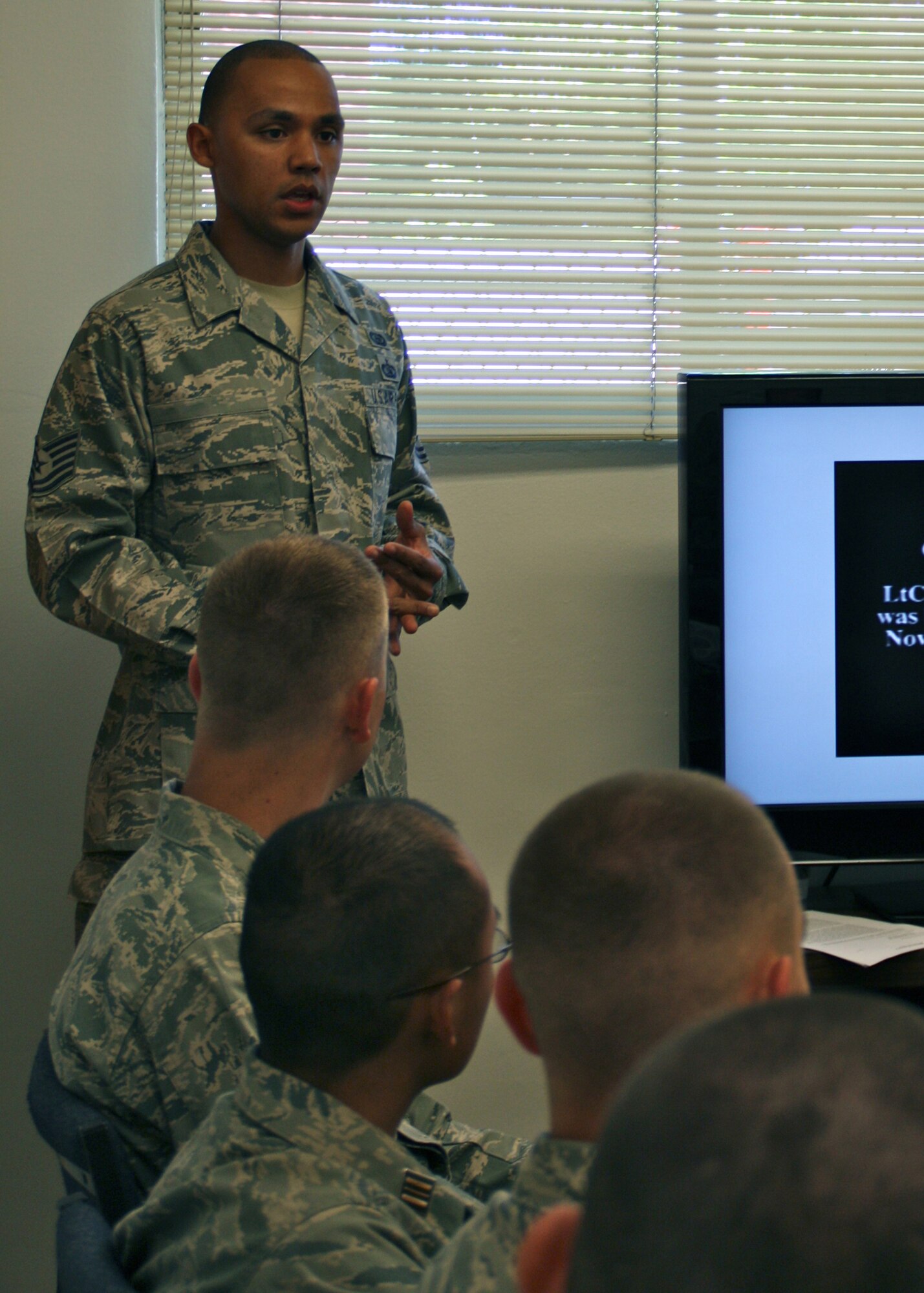 Tech. Sgt. Jewell, 13th Intelligence Squadron, speaks to Sacramento State Air Force ROTC cadets about the Air Force Code of Conduct May 2, 2012 at the university campus in Sacramento, Calif. The goal of the visit to the campus was to bring personnel outside of the Air Force ROTC cadre to help expand cadet?s knowledge. (U.S. Air Force courtesy photo. This image has been altered for operational security)