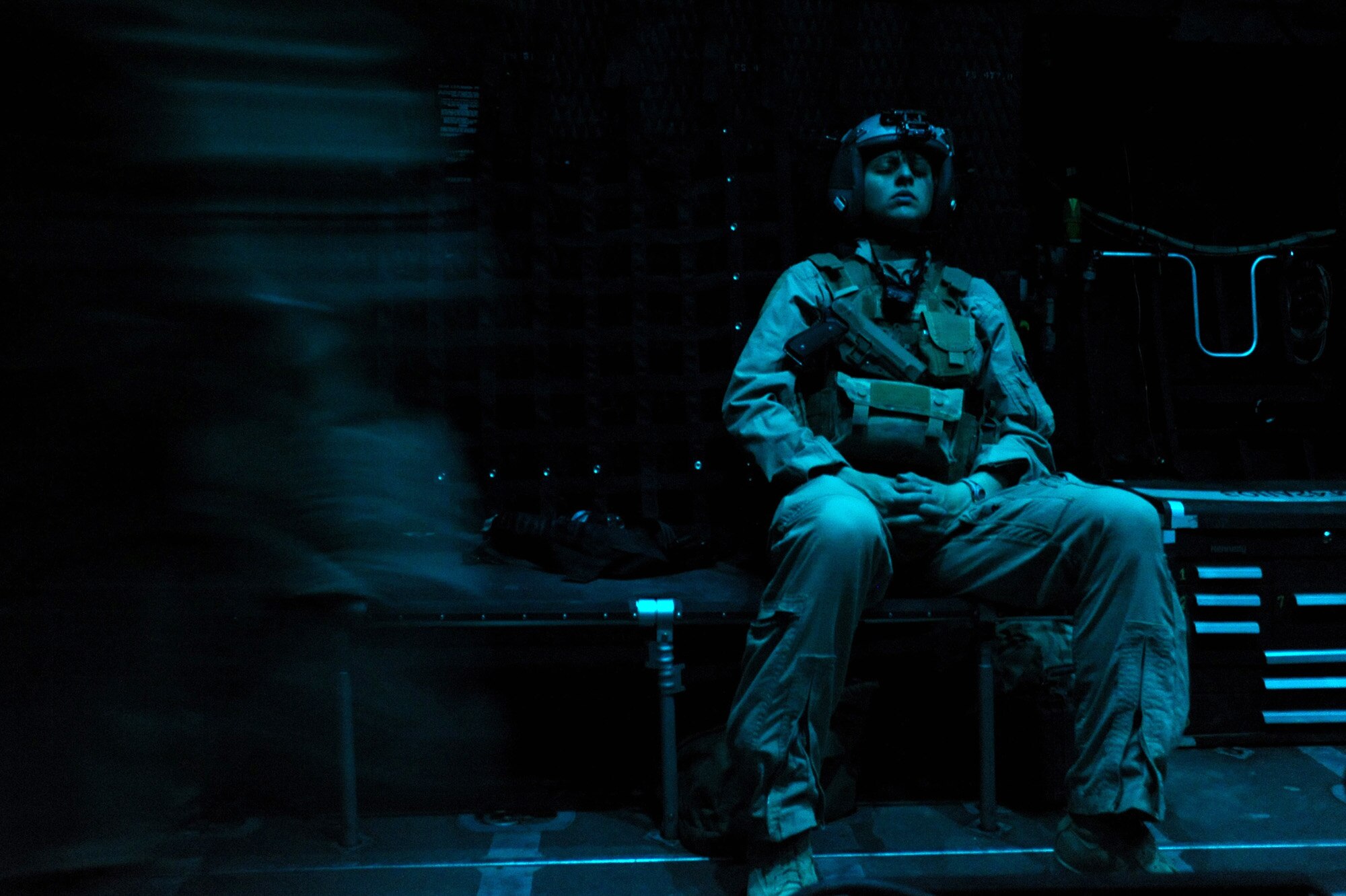 Capt. Susan Marchiano rests before arriving at a pick-up location for a severely wounded U.S. service member aboard an HC-130 P/N King aircraft April 12, 2010, over Afghanistan. Marchiano was selected at the Air Force's top flight surgeon. (U.S. Air Force photo/Staff Sgt. Manuel J. Martinez)