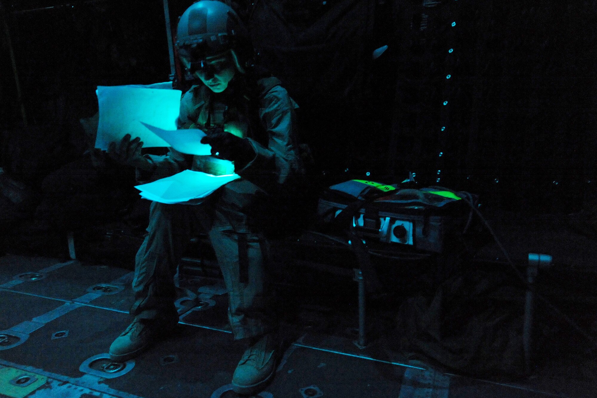 Capt. Susan Marchiano looks over a wounded U.S. armed forces member's treatment notes while he is being transported to a field hospital aboard an HC-130 P/N King aircraft April 12, 2010, in Afghanistan. Marchiano was a flight doctor assigned to the 79th Expeditionary Rescue Squadron.  (U.S. Air Force photo/Staff Sgt. Manuel J. Martinez)