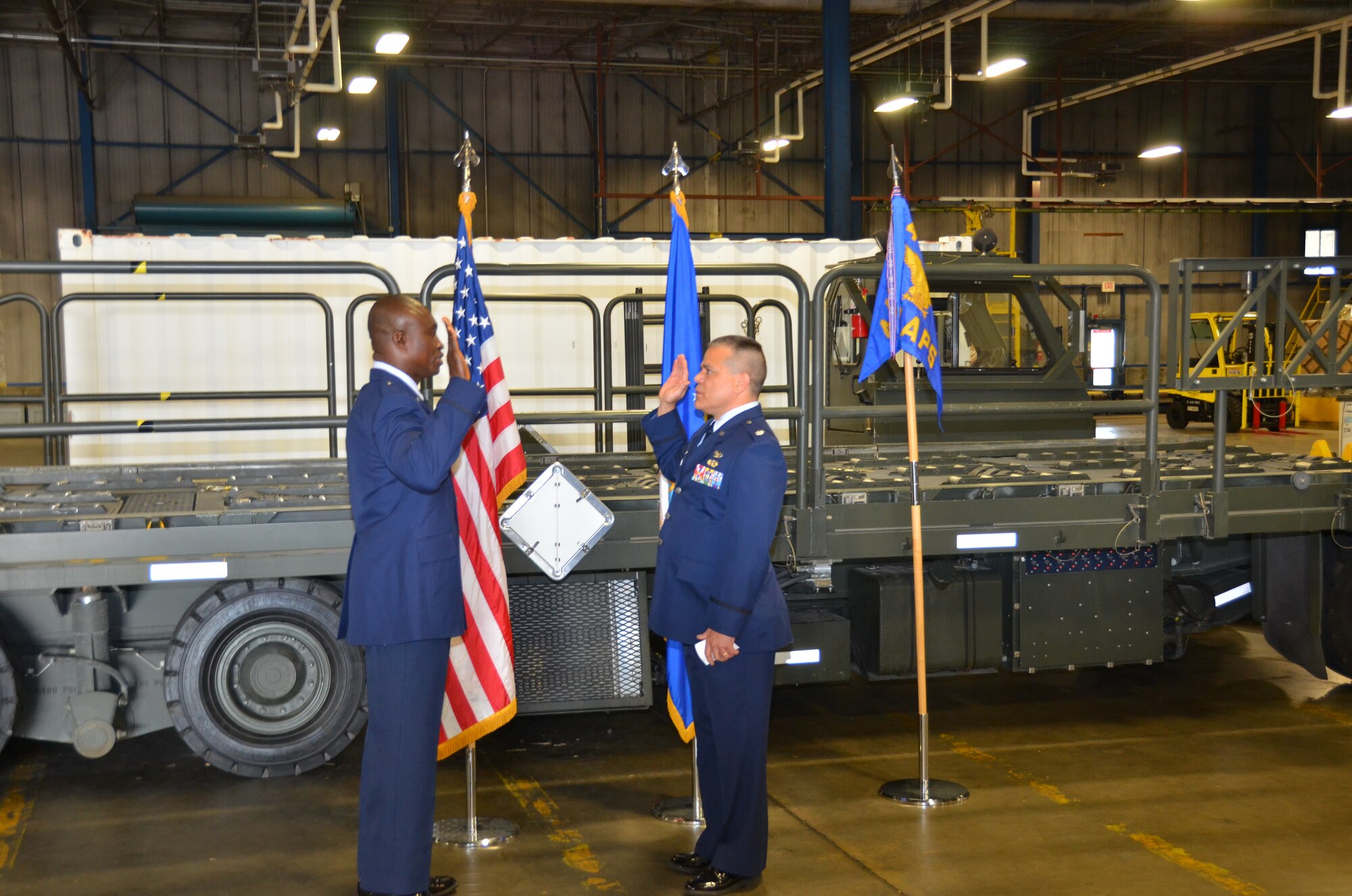 WRIGHT-PATTERSON AIR FORCE BASE, Ohio – Lt. Col John Marang, 87th Aerial Port Squadron commander, administers the oath of office to Tech. Sgt., now 1st Lt. Will Smith, 87th APS air transportation craftsman, during Smith’s commissioning ceremony May 19. (U.S. Air Force photo/Master Sgt. Charlie Miller)