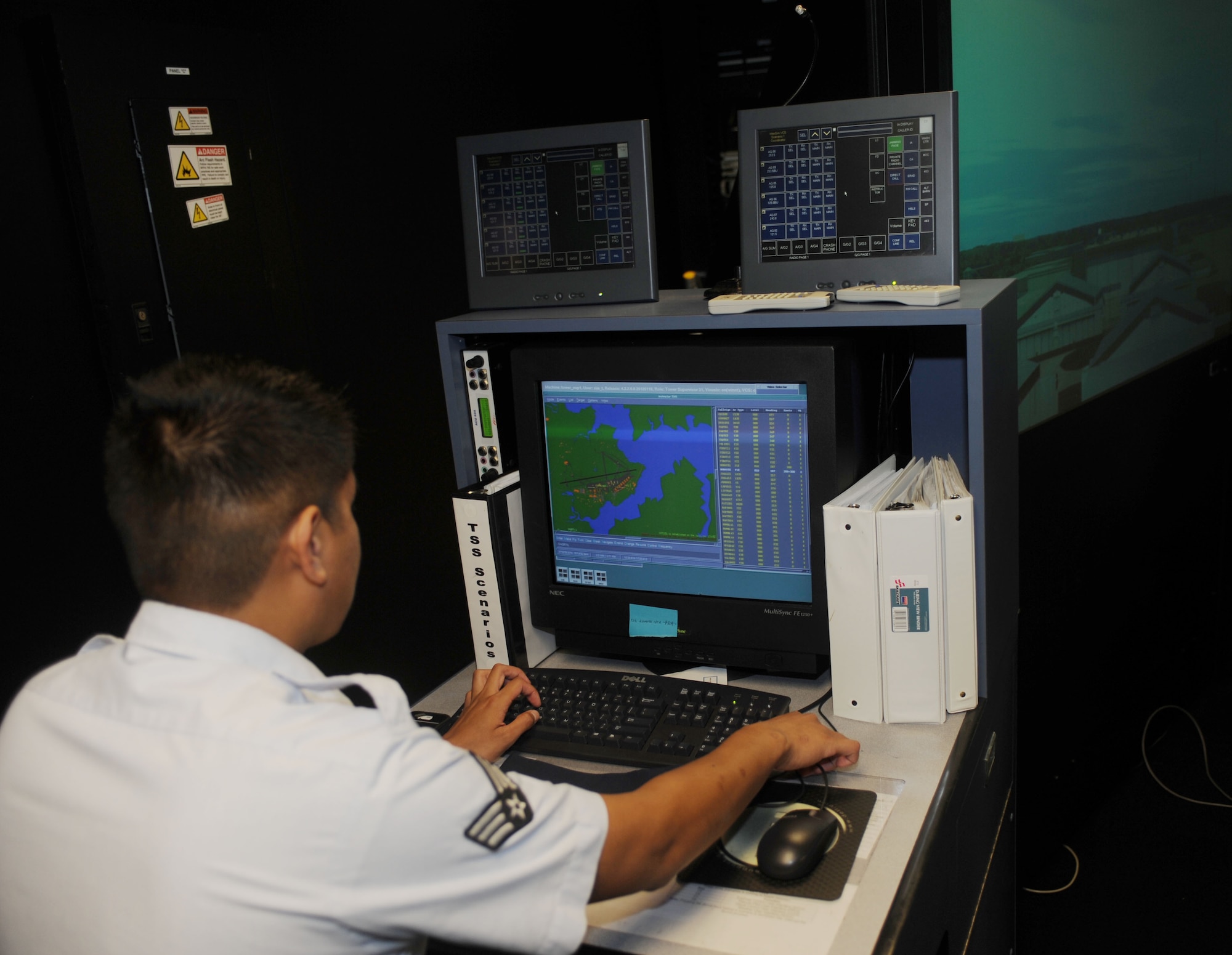 Senior Airman Jeffrey Villa, 1st Operations Support Squadron air traffic control specialist, runs the training program for the Airmen still in training at Langley Air Force Base, Va., June 4. After graduation of technical school, air traffic control Airmen must still certify in the three areas of air traffic control, which are flight data, local controller and ground controller. (U.S. Air Force photo by Airman 1st Class Austin C. Harvill) 