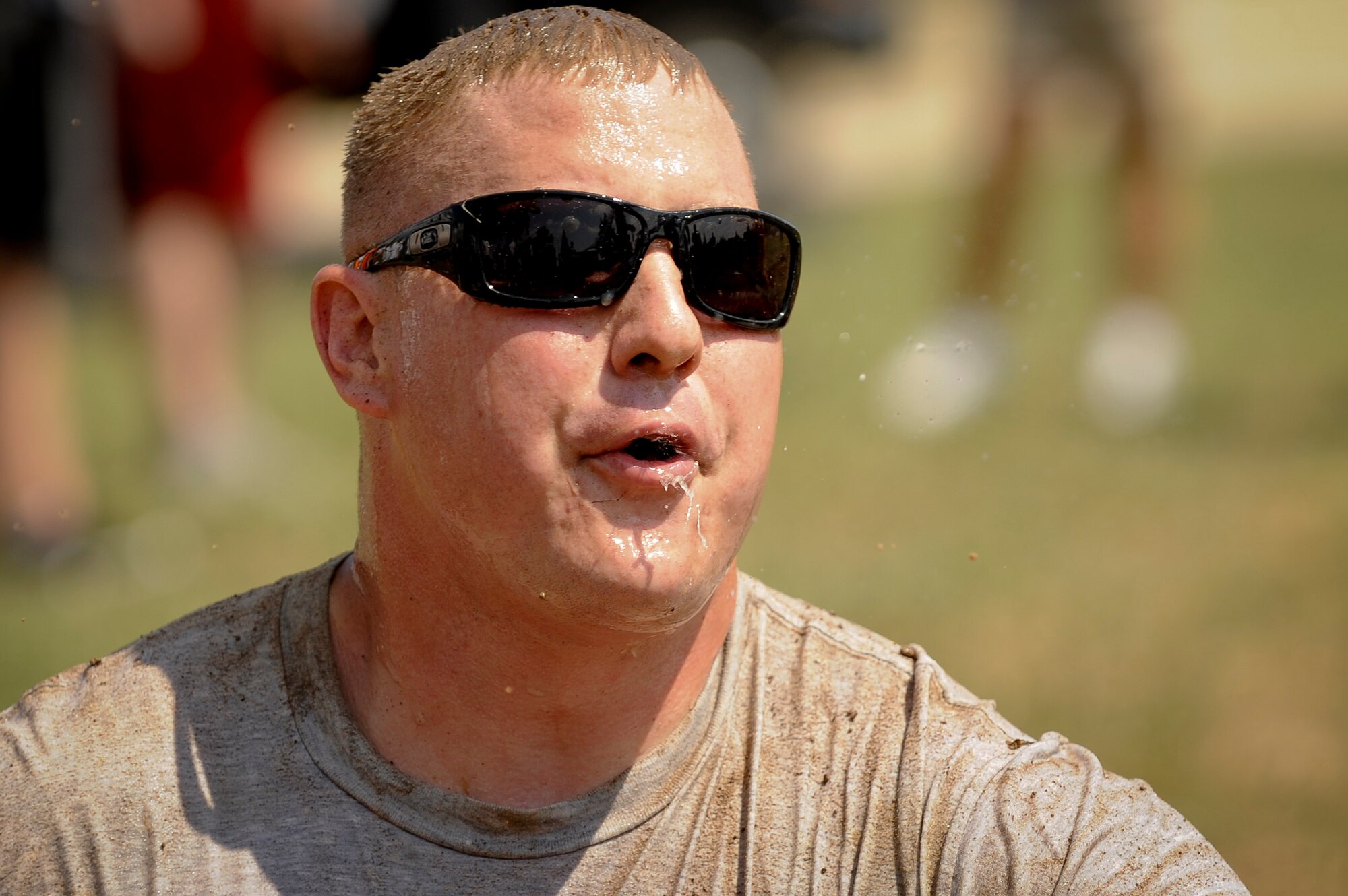 Joshua Ramstead recovers after jumping into the mud pit during during the 39th Air Base Wing Sports Day tug-of-war event June 1, 2012, at Incirlik Air Base, Turkey. Sports day was an event that brought Airmen together through sports and recreation. Airmen from several squadrons competed in friendly games of volleyball, softball, basketball, kickball, dodgeball and tug-of-war. (U.S. Air Force photo by Senior Airman Jarvie Z. Wallace/Released)
