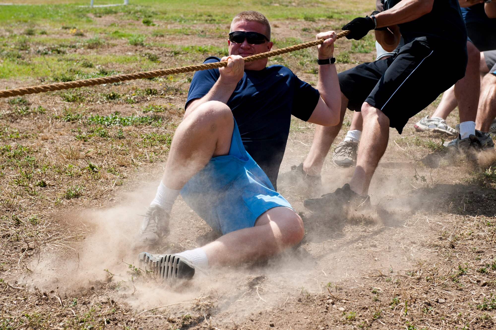 The 39th Logistics Readiness Squadron team slide toward a mud pit during a game of tug-of-war during the 39th Air Base Wing Sports Day June 1, 2012, at Incirlik Air Base, Turkey. Sports day consisted of Incirlik Airmen competing in 13 different sporting events ranging from dodgeball and kickball to bowling and golf. (U.S. Air Force photo by Senior Airman Anthony Sanchelli/Released)
