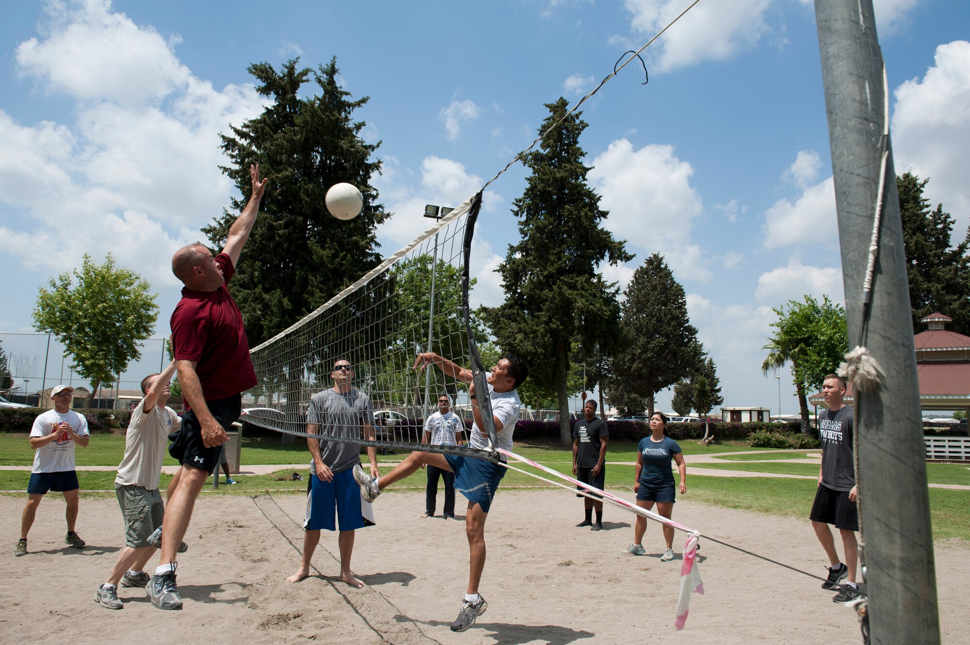 Participants compete in a game of sand volleyball during the 39th Air Base Wing Sports Day June 1, 2012, at Incirlik Air Base, Turkey. Sports day consisted of Incirlik Airmen competing in 13 different sporting events ranging from dodgeball and kickball to bowling and golf. (U.S. Air Force photo by Senior Airman Anthony Sanchelli/Released)
