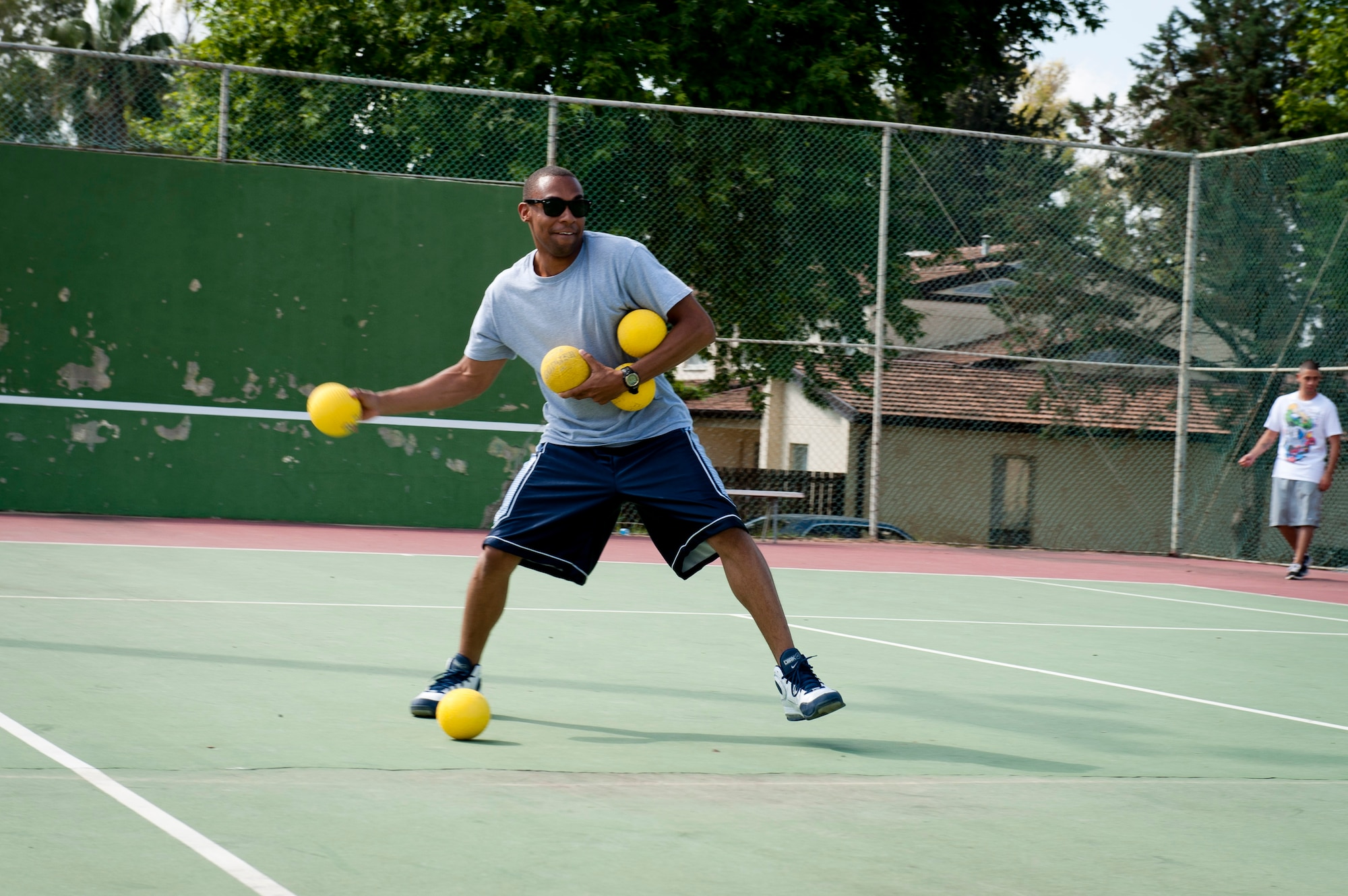 A member of the 39th Logistics Readiness Squadron team holds all dodgeballs during the 39th Air Base Wing Sports Day June 1, 2012, at Incirlik Air Base, Turkey. The 39th LRS team lost three out of three games against the 39th Operations Squadron. (U.S. Air Force photo by Senior Airman Anthony Sanchelli/Released)