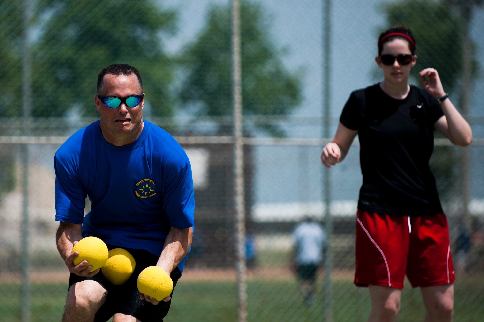 Michael Mayo, left, and Rachel Johnston, both from the 39th Operations Squadron, play dodgeball during the 39th Air Base Wing Sports Day June 1, 2012, at Incirlik Air Base, Turkey. The 39th OS team took first place overall in dodgeball. (U.S. Air Force photo by Tech. Sgt. Michael B. Keller/Released)