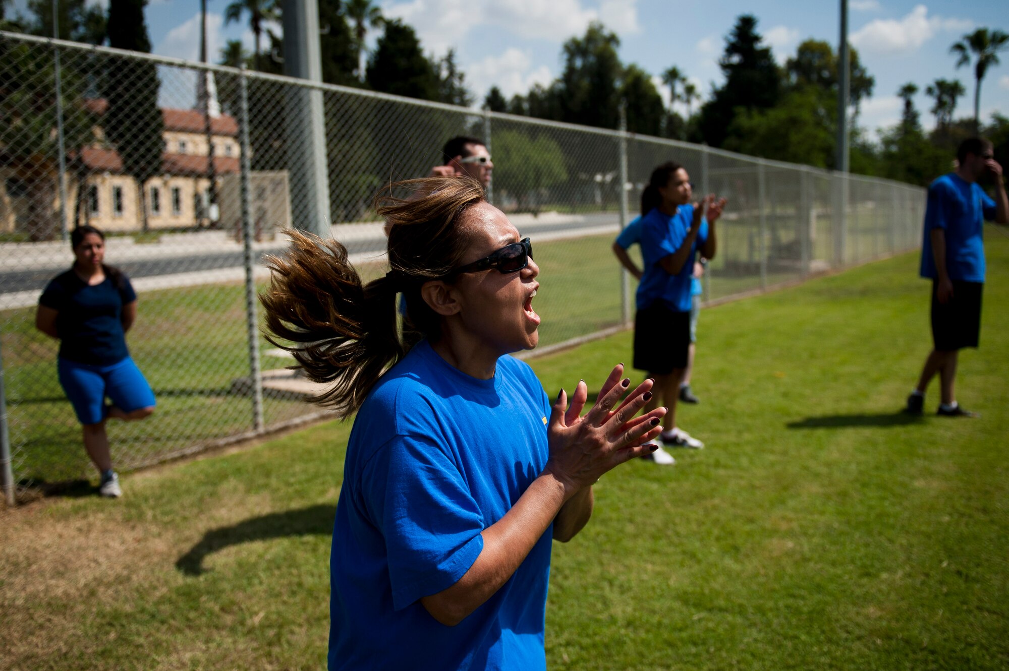 Kim Arnold, 39th Contracting Squadron commander, cheers for her teammates during the 39th Air Base Wing Sports Day June 1, 2012, at Incirlik Air Base, Turkey. The 39th CONS team lost to the 39th Security Forces Squadron team 10-11. (U.S. Air Force photo by Tech. Sgt. Michael B. Keller/Released)