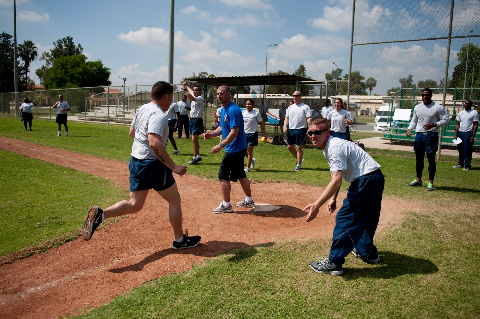 A 39th Security Forces Squadron kickball team member scores a run during the 39th Air Base Wing Sports Day June 1, 2012, at Incirlik Air Base, Turkey. The 39th SFS team won the game 11-10. (U.S. Air Force photo by Tech. Sgt. Michael B. Keller/Released)