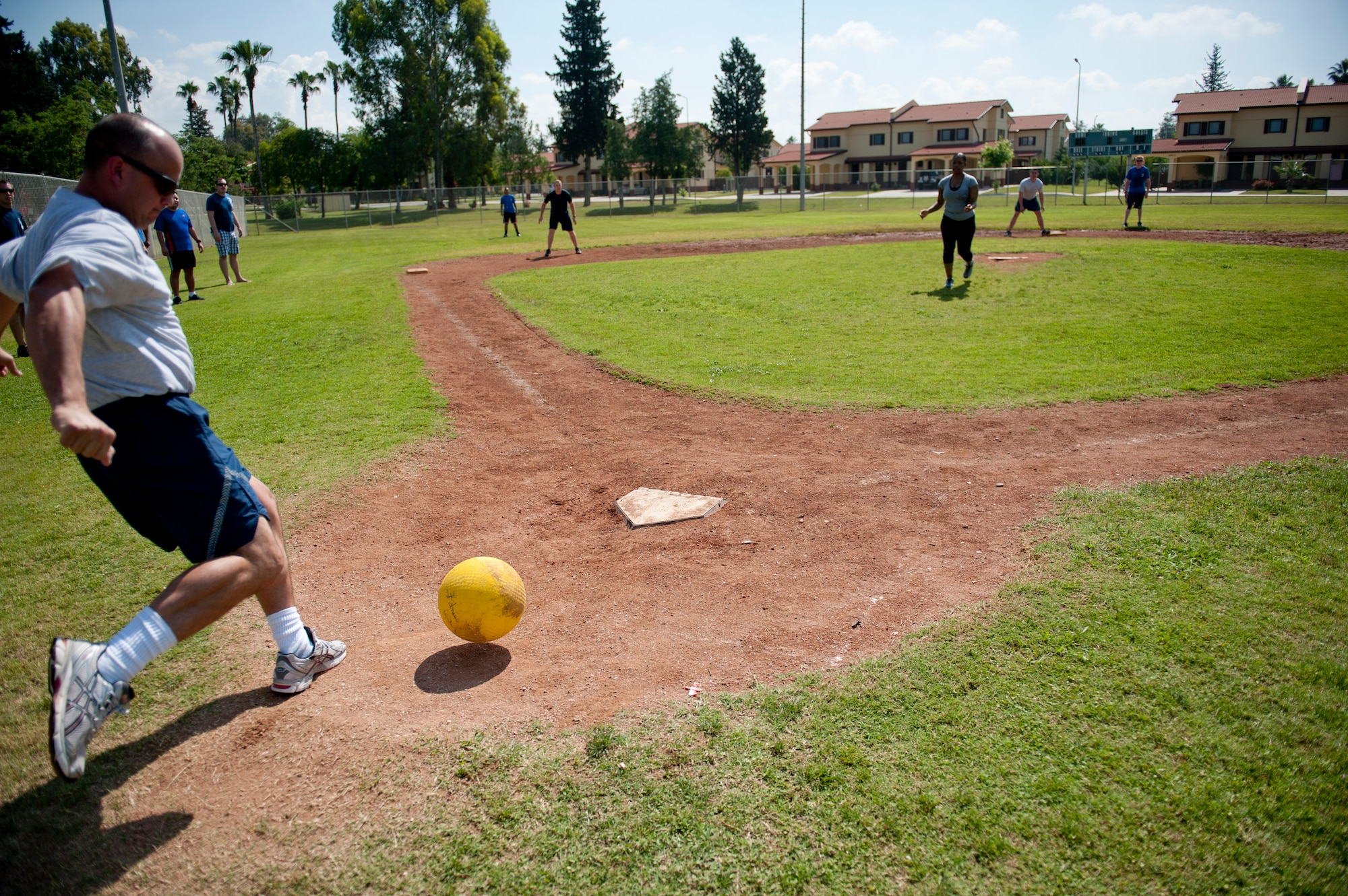 The 39th Security Forces Squadron and 39th Contracting Squadron teams play kickball during the 39th Air Base Wing Sports Day June 1, 2012, at Incirlik Air Base, Turkey. The 39th SFS team won the game 11-10. (U.S. Air Force photo by Tech. Sgt. Michael B. Keller/Released)