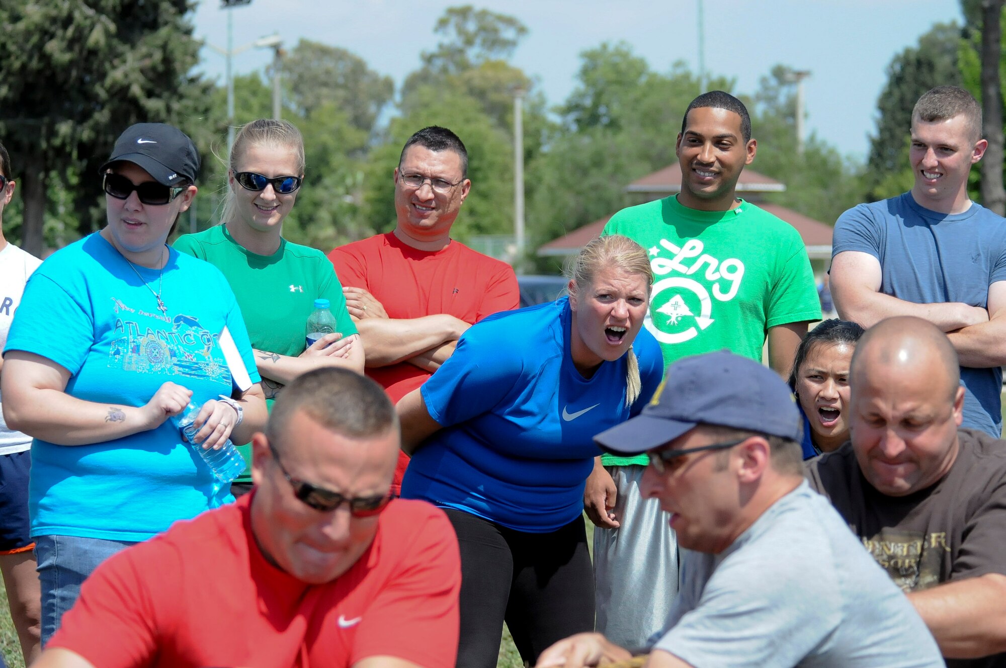 Onlookers shout for the 39th Logistic Readiness Squadron team to pull harder against the 39th Security Forces Squadron team at a tug-of-war match during the 39th Air Base Wing Sports Day day June 1, 2012, at Incirlik Air Base, Turkey. The 39th LRS team was unable to defeat the defenders, who were later named tug-of-war champions. (U.S. Air Force photo by Senior Airman Marissa Tucker/Released)