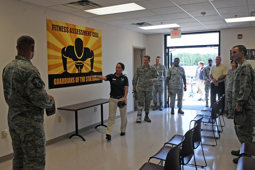 U.S. Air Force Tech. Sgt. Tracy Christensen conducts a tour of the new fitness assessment cell on Seymour Johnson Air Force Base, N.C., May 31, 2012. Augmentees will assist the FAC staff in conducting physical fitness testing to increase the number of assessments that can be offered. Christensen, 4th Force Support Squadron fitness assessment cell NCO in charge, is from Jersey Shore, Pa. (U.S. Air Force photo/Airman 1st Class John Nieves Camacho/Released)
