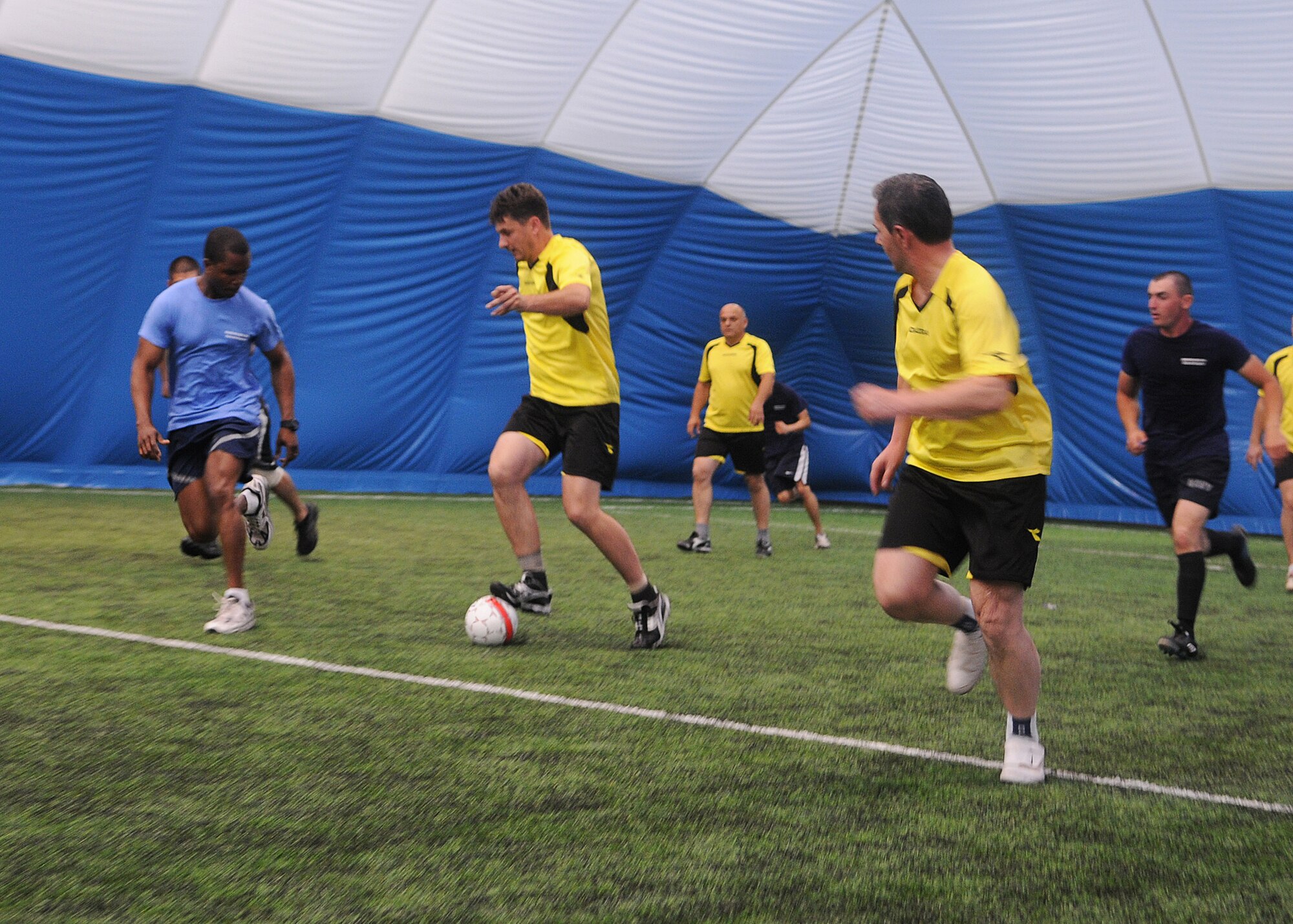 CAPLJINA, Bosnia and Herzegovina -- U.S. military members, including members of the 48th Fighter Wing, participating in Shared Resilience 2012 and the Municipal of Capljina soccer team play soccer at the Sports Center Capljina June 1, 2012. The local team won the match 20-2. More than 500 military members from nine nations are participating in SR12, the annual U.S. Joint Chiefs of Staff sponsored medical exercise, May 28 - June 8. The goals of the exercise are to strengthen interoperability, facilitate training in crisis response and disaster management, and validate the readiness of deployable military medical and humanitarian assistance teams. The exercise, in the spirit of partnership for peace, directly supports U.S. European Command's theater cooperation efforts and strategy for active security with European countries. (U.S. Air Force photo by Staff Sgt. Tabitha Lee)