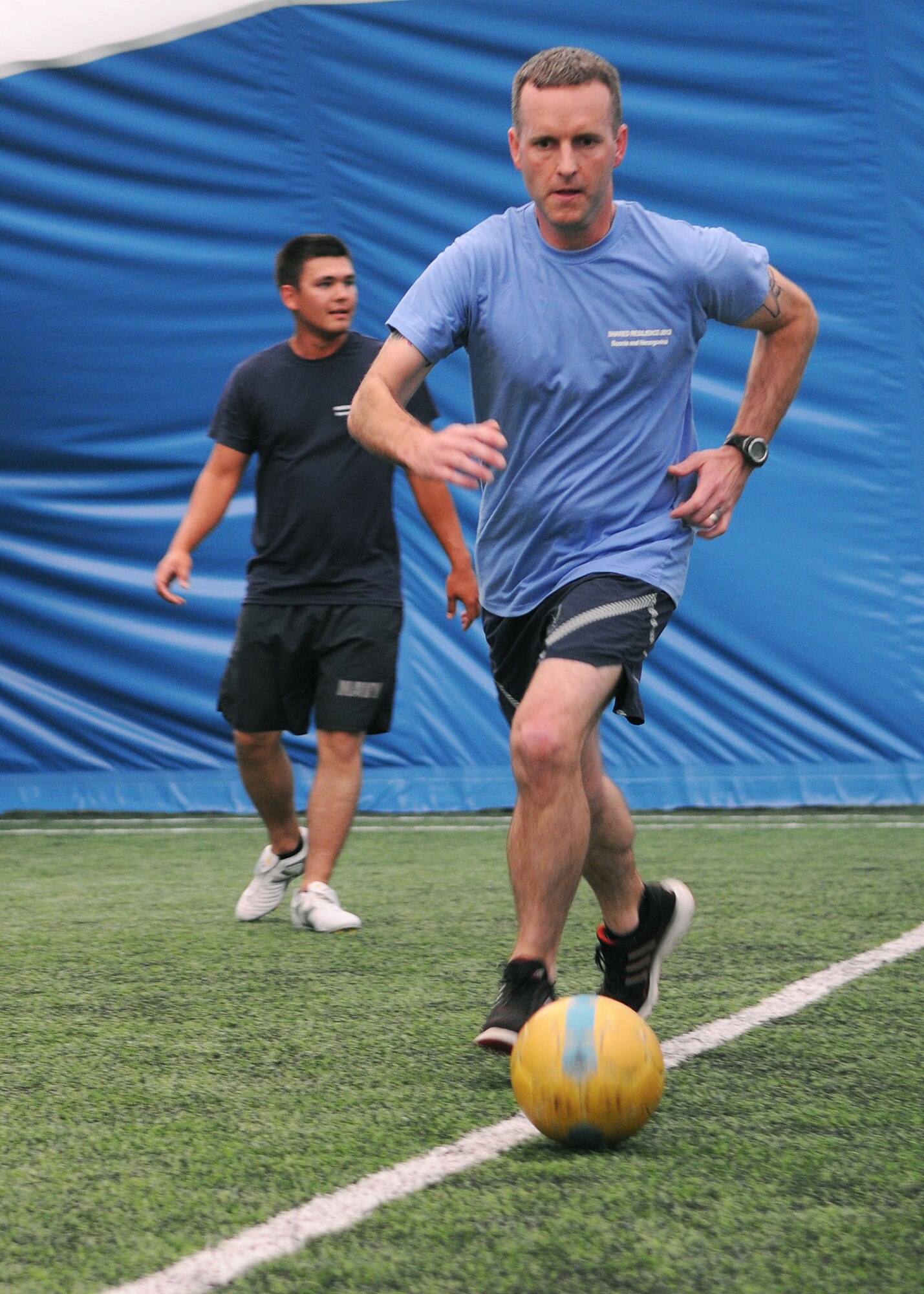 CAPLJINA, Bosnia and Herzegovina -- Tech. Sgt. Andrew Morgan, 48th Fighter Wing chaplain assistant, advances the ball during practice before a game between the U.S. military members participating in Shared Resilience 2012 and the Manicipal of Capljina soccer team at the Sports Center Capljina June 1, 2012. The local team won the match 20-2. More than 500 military members from nine nations are participating in SR12, the annual U.S. Joint Chiefs of Staff sponsored medical exercise, May 28 - June 8. The goals of the exercise are to strengthen interoperability, facilitate training in crisis response and disaster management, and validate the readiness of deployable military medical and humanitarian assistance teams. The exercise, in the spirit of partnership for peace, directly supports U.S. European Command's theater cooperation efforts and strategy for active security with European countries. (U.S. Air Force photo by Staff Sgt. Tabitha Lee)