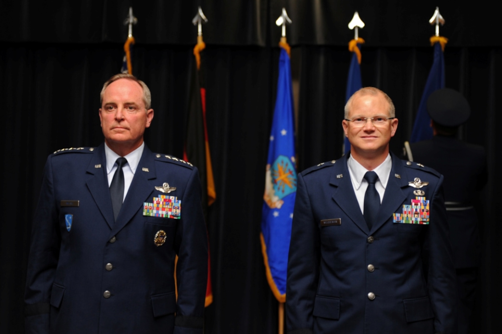 SPANGDAHLEM AIR BASE, Germany – General Mark A. Welsh III, left, U.S. Air Forces in Europe commander, and Col. Chris Weggeman, 52nd Fighter Wing commander, stand at attention while Tech. Sgt. Levi Williams, 52nd FW Honor Guard member, posts Weggeman’s general officer flag during a ceremonial pin-on at the Club Eifel ballroom here June 1. Airmen, family and friends attended the ceremony to celebrate Weggeman’s promotion to the rank of brigadier general, which is effective June 5. (U.S. Air Force photo by Airman 1st Class Matthew B. Fredericks/Released)