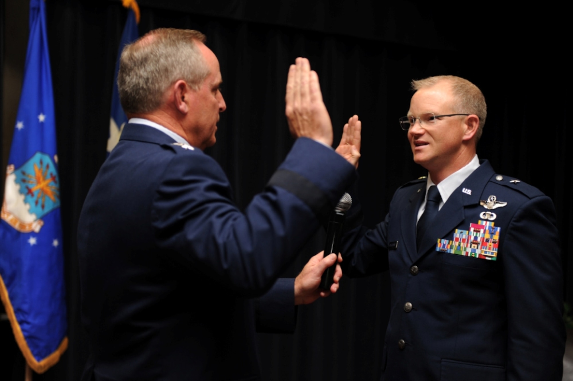 SPANGDAHLEM AIR BASE, Germany – General Mark A. Welsh III, U.S. Air Forces in Europe commander, readministers the oath of office to Col. Chris Weggeman, 52nd Fighter Wing commander, during a ceremonial pin-on at the Club Eifel ballroom here June 1. Airmen, family and friends attended the ceremony to celebrate Weggeman’s promotion to the rank of brigadier general, which is effective June 5. (U.S. Air Force photo by Airman 1st Class Matthew B. Fredericks/Released)