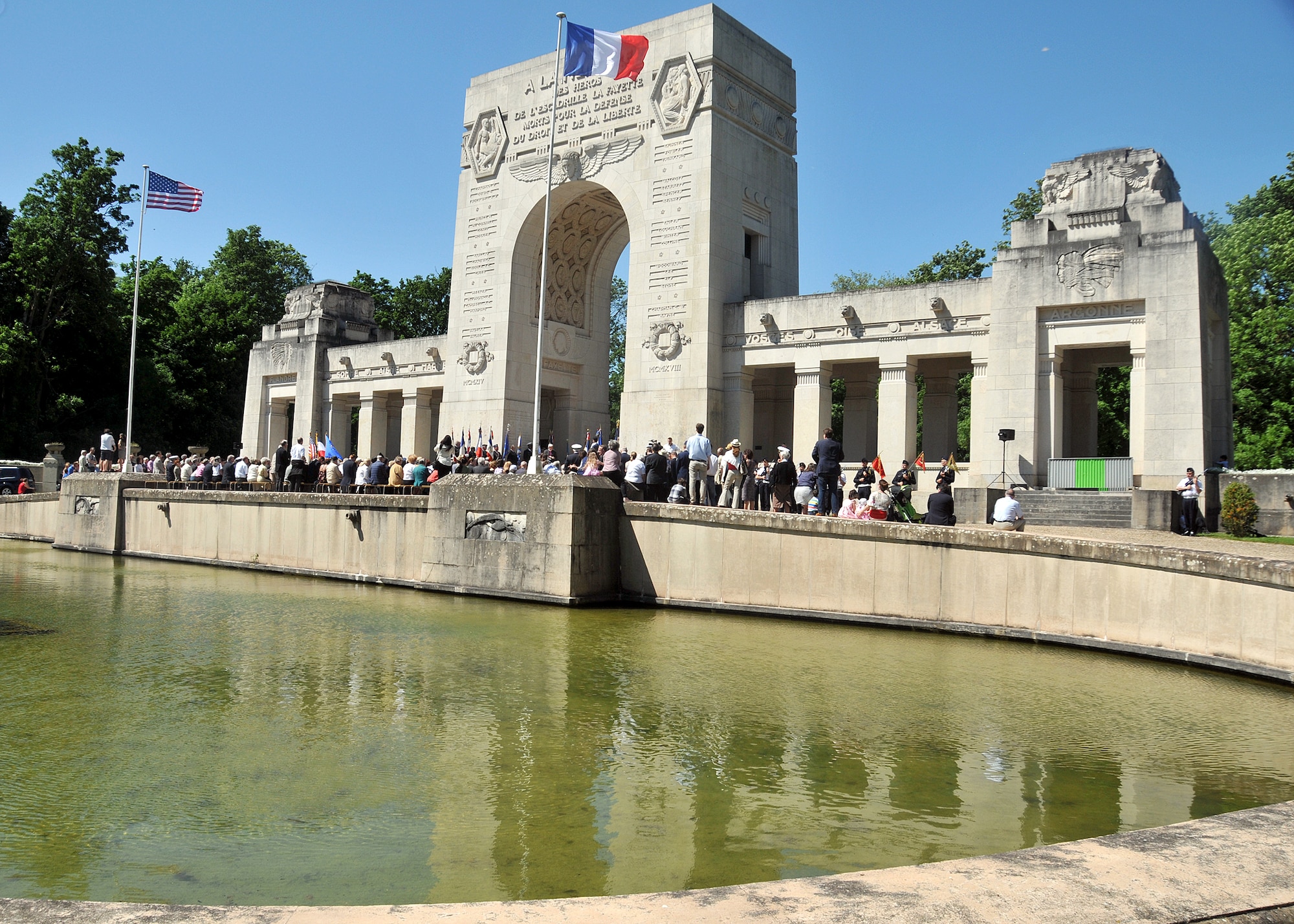 French and U.S. veterans, civilians and servicemembers participate at a Memorial Day ceremony at the Lafayette Escadrille Memorial located on the outskirts of Paris, May 26, 2012. The memorial honors American pilots who volunteered to join the French Escadrille Lafayette and the Lafayette Flying Corps during World War I and also serves as a final resting place for the remains of 49 of those pilots. (U.S. Air Force Photo by Tech. Sgt. Markus M. Maier) (Released)