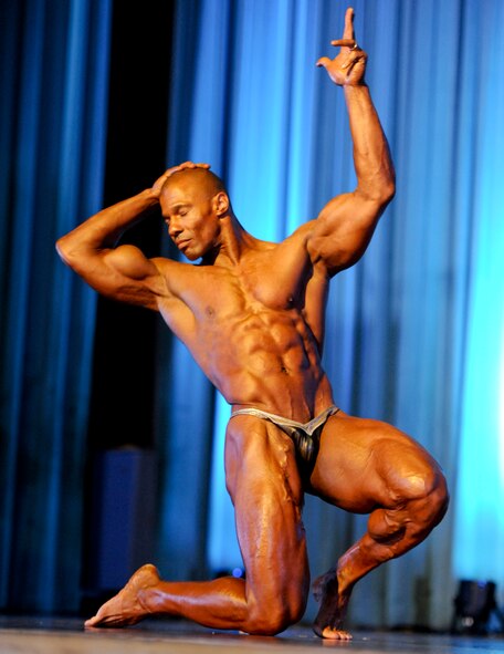 Philip "Rico" Ricardo Jr., U.S. Marine Corps Master Sgt. (retired), performs a routine during his guest appearance at the 6th Annual Pacific Muscle Classic on Kadena Air Base, Japan, June 3, 2012. Rico is a 12-time professional natural bodybuilding champion, as well as the 2010 Yorton Cup Men's Pro Bodybuilding Champion. (U.S. Air Force photo/Airman 1st Class Justin Veazie)