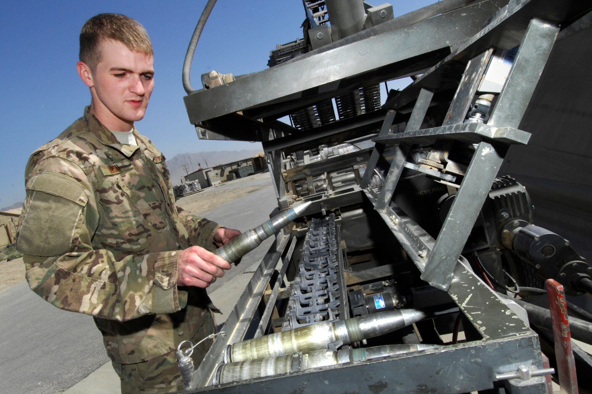 Senior Airman Jacob Rush, 455th Expeditionary Maintenance Squadron 
Armament Systems technician, performs an operational check on a 
GFU-7E Ammunition Loading Adapter at Bagram Airfield, Afghanistan, 
June 4, 2012. The loading adapter is used to upload and download 30mm 
ammo into the A-10C Thunderbolt II. Rush’s hard work and professionalism 
is a key factor in maintaining Bagram’s A-10Cs’ mission capable status 
enabling the aircraft to fly in support of coalition ground forces in 
Afghanistan. (U.S. Air Force photo/Staff Sgt. Jeff Nevison)
