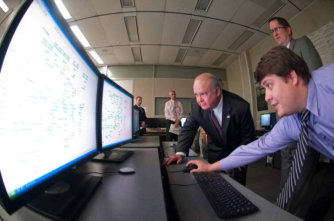 ALEXANDRIA, Va. -- Under Secretary of the Army Joseph W. Westphal reviews a chart of organizational structure at the U.S. Army Geospatial Center, May 30, 2012. The Under Secretary of the Army visited the U.S. Army Geospatial Center to gain situational awareness and ensure the Army is correctly prioritizing, balancing and integrating resources to support the contributions of this mission-critical organization.