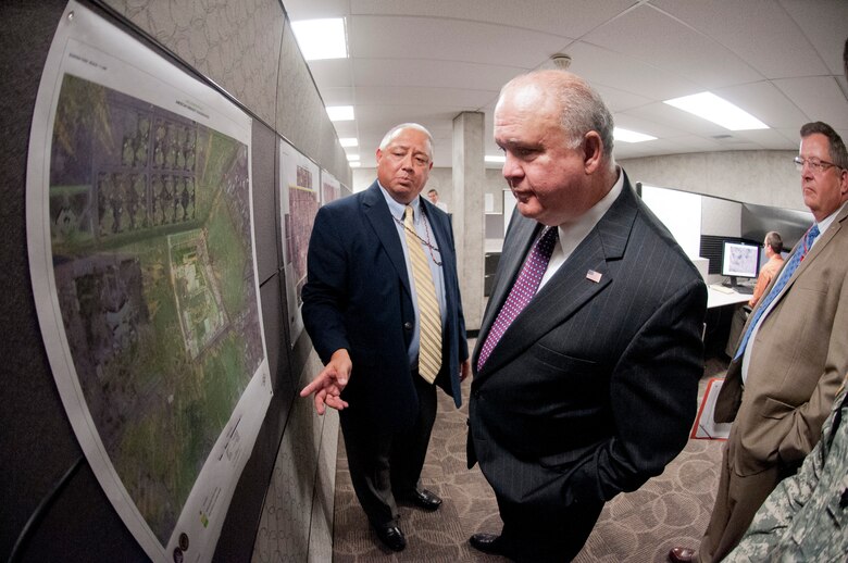ALEXANDRIA, Va. -- Under Secretary of the Army Joseph W. Westphal inspects a two dimensional type of map used by warfighters in Afghanistan at the U.S. Army Geospatial Center, May 30, 2012, in Alexandria, Va. The Under Secretary of the Army visited the U.S. Army Geospatial Center to gain situational awareness and ensure the Army is correctly prioritizing, balancing and integrating resources to support the contributions of this mission-critical organization.