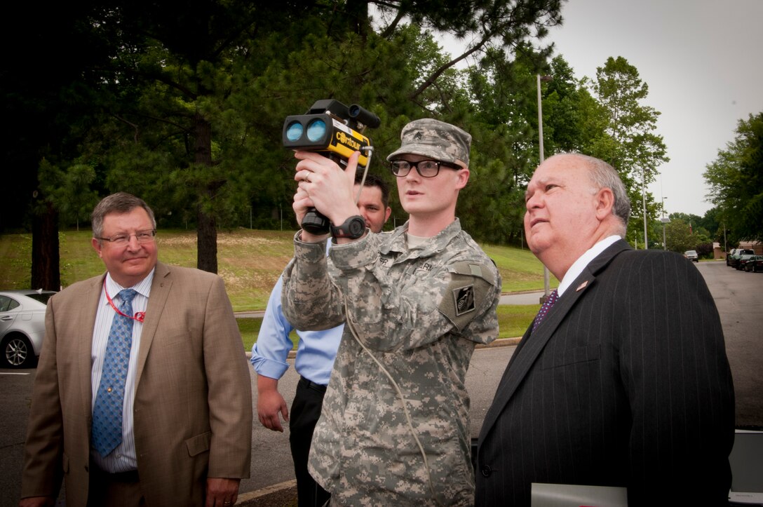 ALEXANDRIA, Va. -- Cpl. Welker shows Under Secretary of the Army Joseph W. Westphal state-of-the-art technology at the U.S. Army Geospatial Center, May 30, 2012, in Alexandria, Va. The Under Secretary of the Army visited the U.S. Army Geospatial Center to gain situational awareness and ensure the Army is correctly prioritizing, balancing and integrating resources to support the contributions of this mission-critical organization.
