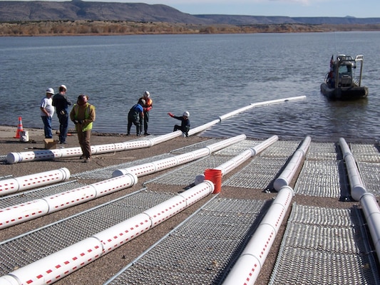 The Corps installed 50, 20-foot-long log booms in the canyon portion of Cochiti Lake, a half mile upstream of the Tetilla boat ramp, to catch debris. 