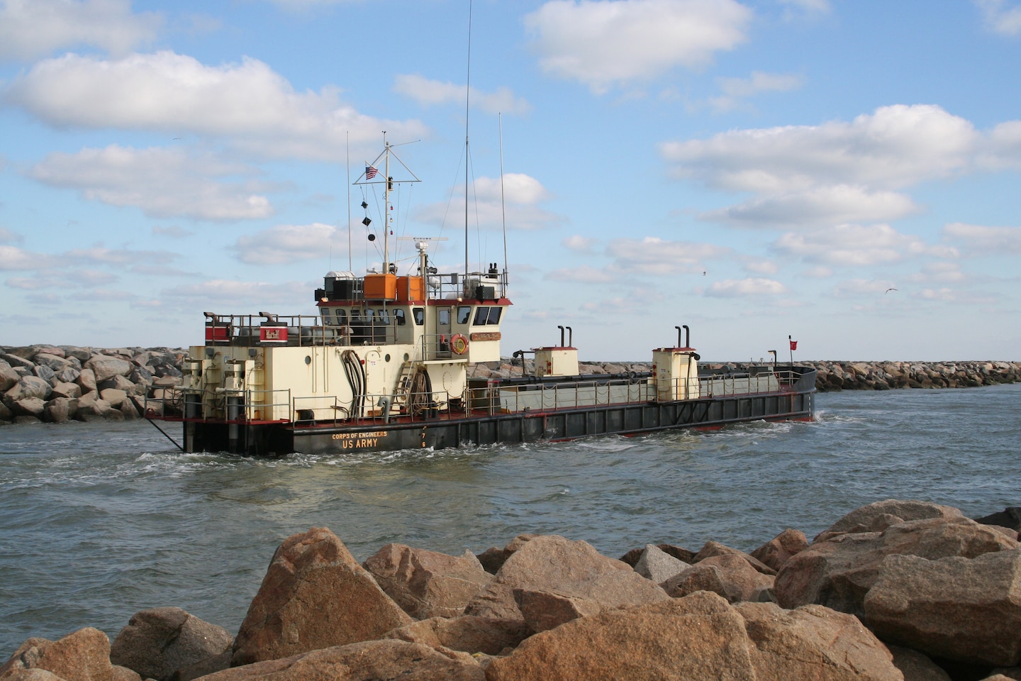 The Corps Dredge Currituck performs dredging operations in Virginia Beach's Rudee Inlet in 2005. The Currituck is a U.S. Army Corps of Engineers hopper dredge that performs maintenance dredging up and down the East Coast. (U.S. Army Photo/Patrick Bloodgood)
