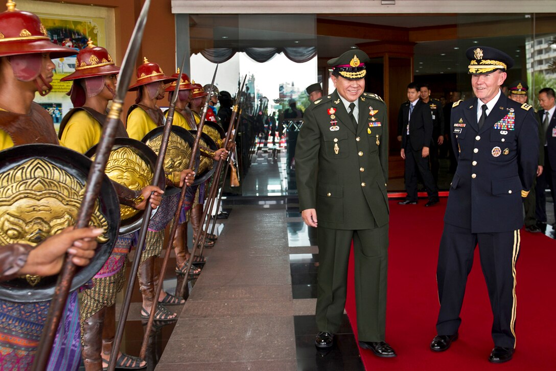 Thai Chief of Defense Forces Gen. Thanasak Patimaprakorn and U.S. Army Gen. Martin E. Dempsey, chairman of the Joint Chiefs of Staff, talk in Bangkok, June 5, 2012.