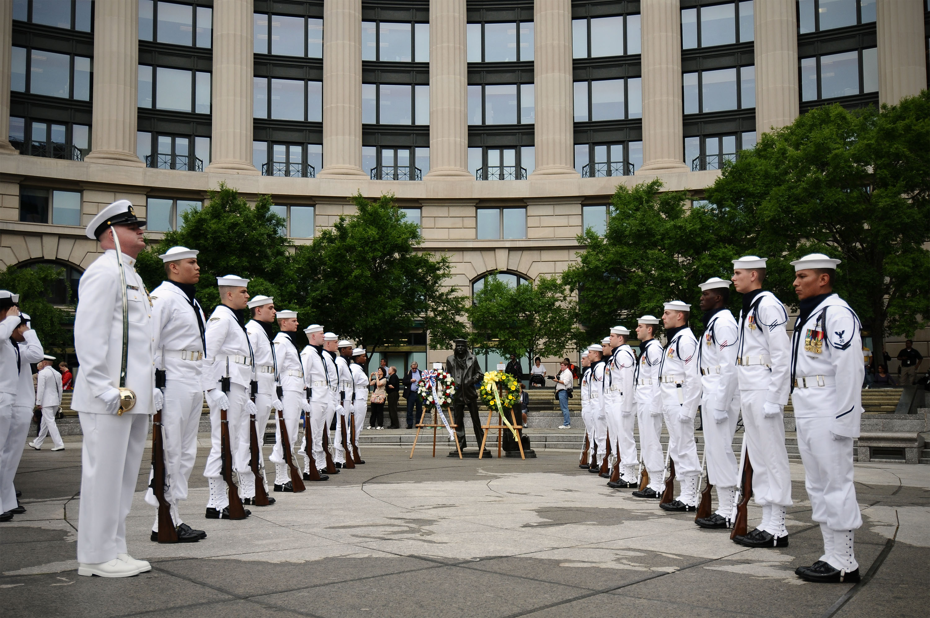 Members of the U.S. Navy Ceremonial Guard Drill Team stands by after