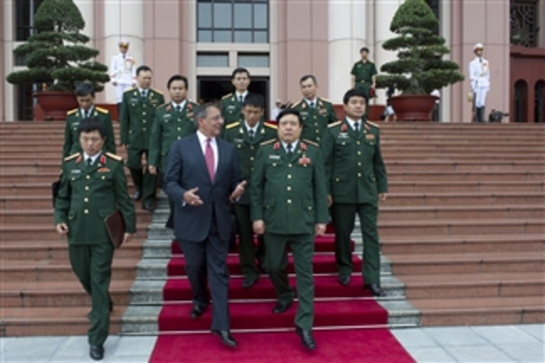Secretary of Defense Leon E. Panetta and Vietnamese Minister of National Defense Senior Lt. Gen. Phuong Quang Thanh depart the Vietnamese defense headquarters in Hanoi, Vietnam, on June 4, 2012.  Panetta is on ten-day trip to the Asia-Pacific to meet with defense counterparts.  