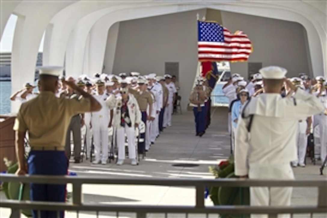 A Navy and Marine Corps color guard displays the colors on the USS Arizona Memorial as participants sing the national anthem during a wreath-laying ceremony to commemorate the 70th anniversary of the Battle of Midway in Honolulu, June 4, 2012. World War II veterans, civilian guests and service members assigned to military bases on Hawaii gathered at the memorial for the event.