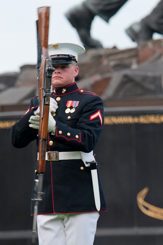 Pfc. Joshua Ummel, Marine Corps Silent Drill Platoon member, spins his M1 Garand rifle in the inspection line as part of the SDP’s performance during a Tuesday Sunset Parade at the Marine Corps War Memorial in Arlington, Va., June 5.