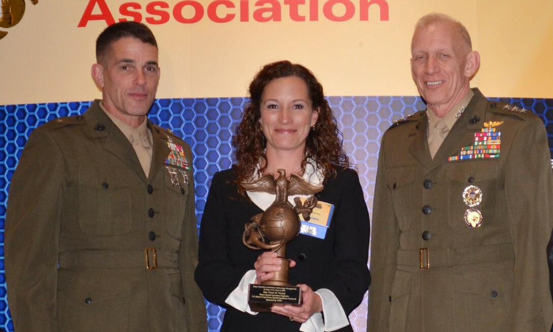 Brigadier Gen. Kevin J. Nally, director, C4 and  Maj. Gen. Robert E. Schmidle, deputy commandant, U.S. Cyber Command, presented awards to members of U.S. Marine Special Operations Command at the Ninth Annual Marine Corps Association and Foundation C4 Awards in Arlington, Va., April 19.  Tonya M. Vannoy was awarded the James Hamilton Information Technology Management Civilian of the Year.