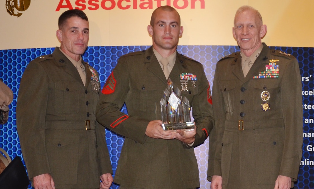 Brigadier Gen. Kevin J. Nally, director, C4 and  Maj. Gen. Robert E. Schmidle, deputy commandant, U.S. Cyber Command, presented awards to members of U.S. Marine Special Operations Command at the Ninth Annual Marine Corps Association and Foundation C4 Awards in Arlington, Va., April 19.  Sgt. Samuel K. Land was awarded the PFC Herbert A. Littleton Noncommissioned Officer Trophy for Operational Communications Excellence.