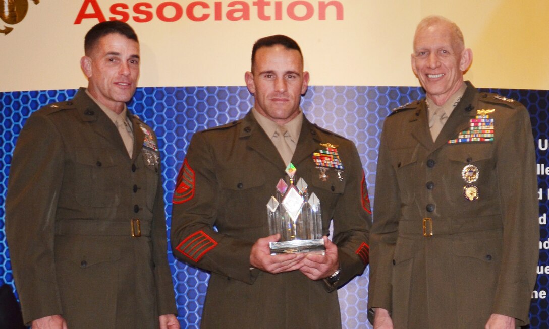 Brigadier Gen. Kevin J. Nally, director, C4 and  Maj. Gen. Robert E. Schmidle, deputy commandant, U.S. Cyber Command, presented awards to members of U.S. Marine Special Operations Command at the Ninth Annual Marine Corps Association and Foundation C4 Awards in Arlington, Va., April 19.  GySgt. Ryan E. Evans was awarded the PFC Herbert A. Littleton Staff Noncommissioned Officer Trophy for Operational Communications Excellence.