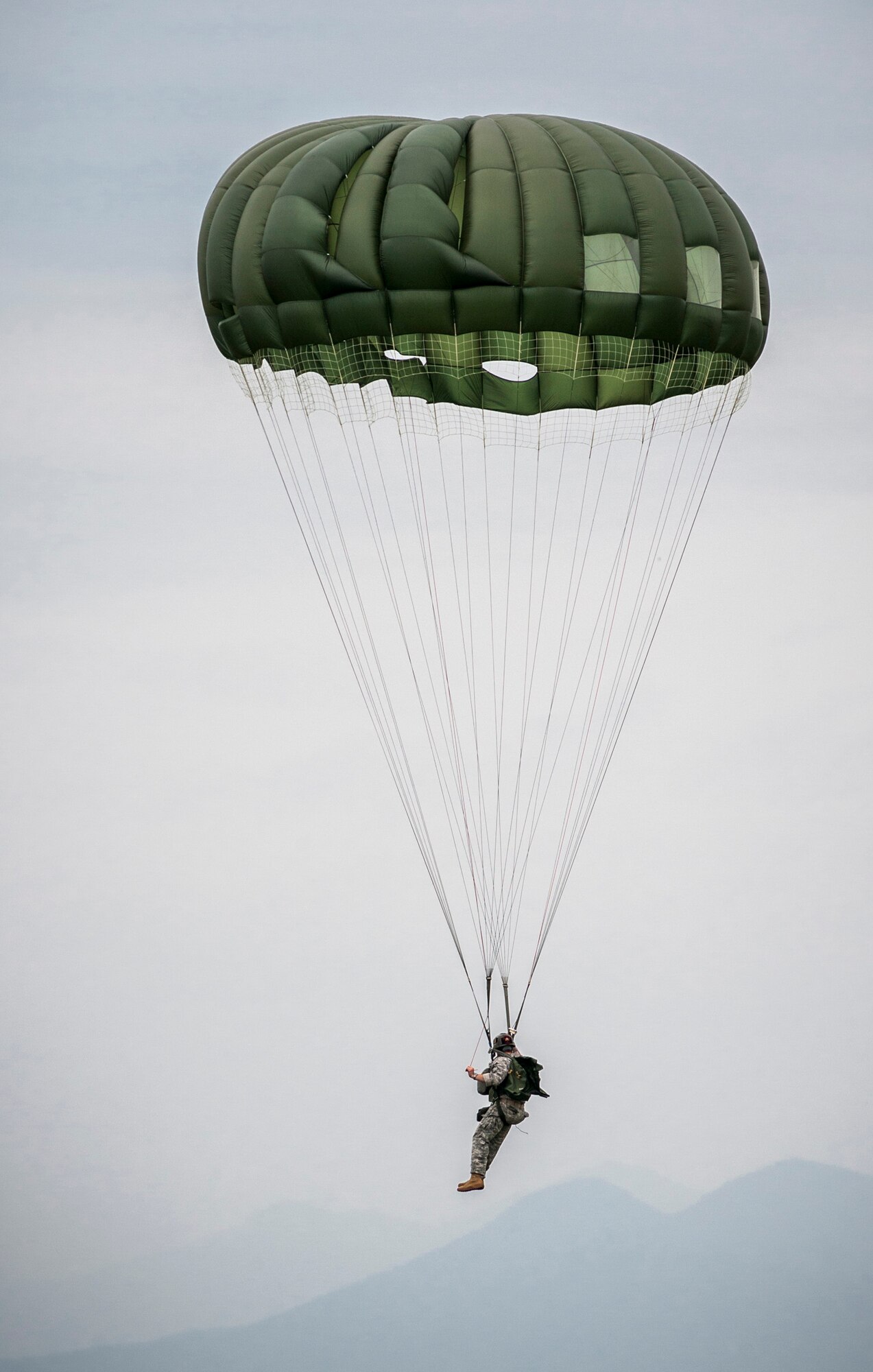 YOKOTA AIR BASE, Japan -- A Soldier controls an open parachute after a low-altitude jump from a C-130 Hercules cargo aircraft during the Samurai Surge at Yokota Air Base, Japan, June 5, 2012. (U.S. Air Force photo by Tech. Sgt. Samuel Morse)