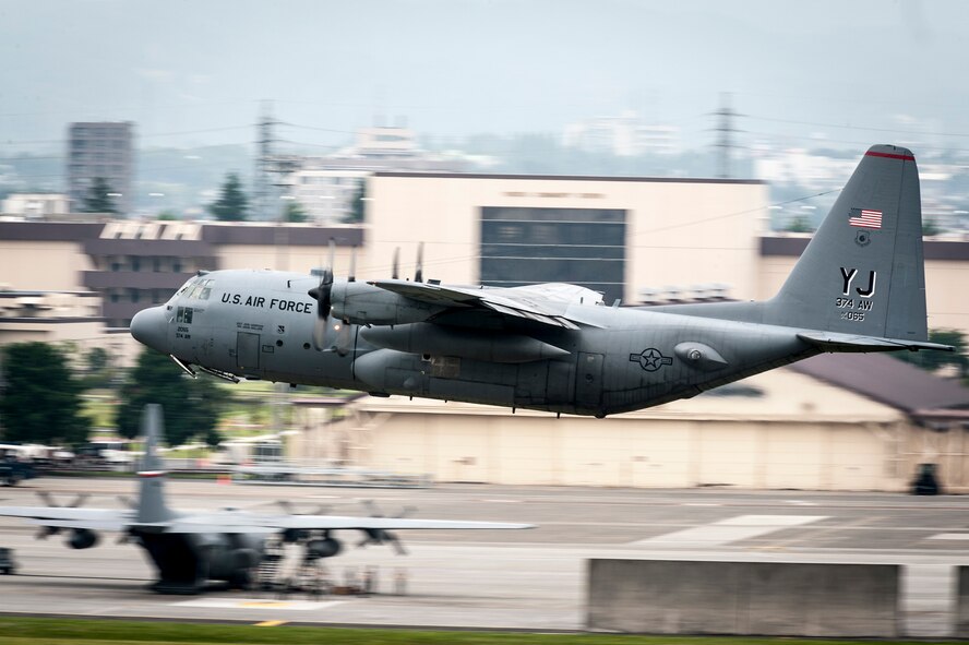 YOKOTA AIR BASE, Japan -- A C-130 Hercules cargo aircraft from the 36th Airlift Squadron takes off at Yokota Air Base, Japan, June 5, 2012. C-130s are a propeller-based aircraft capable of intra-theater airlift mission with minimal runway requirements for landing and takeoff. (U.S. Air Force photo by Tech. Sgt. Samuel Morse)
