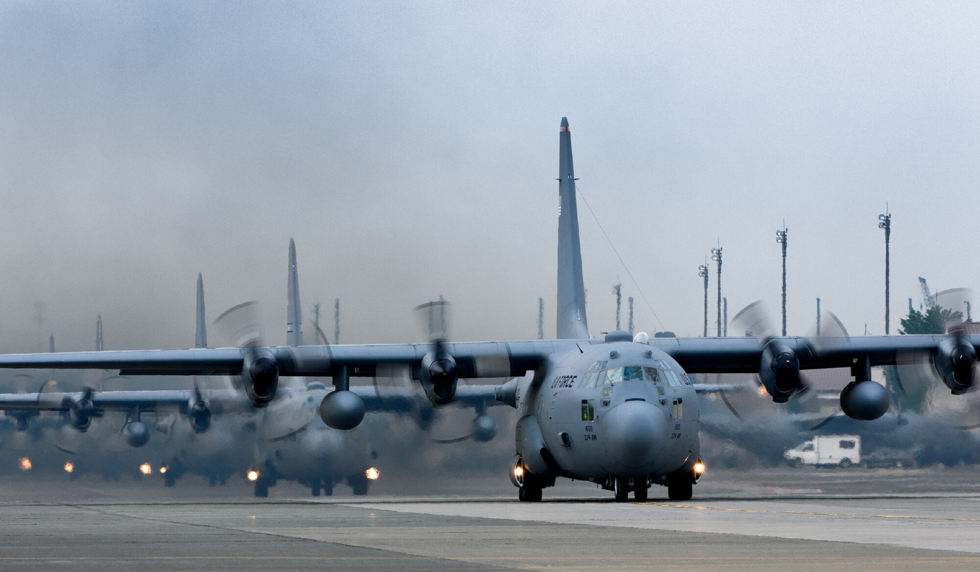 YOKOTA AIR BASE, Japan -- A line of C-130 Hercules from the 36th Airlift Squadron, Alaska Air National Guard, and Tennessee Air National Guard taxi out for an eight-ship sortie at Yokota Air Base, Japan, on June 5, 2012. The sortie was part of a Samurai Surge exercise. (U.S. Air Force photo by Osakabe Yasuo)