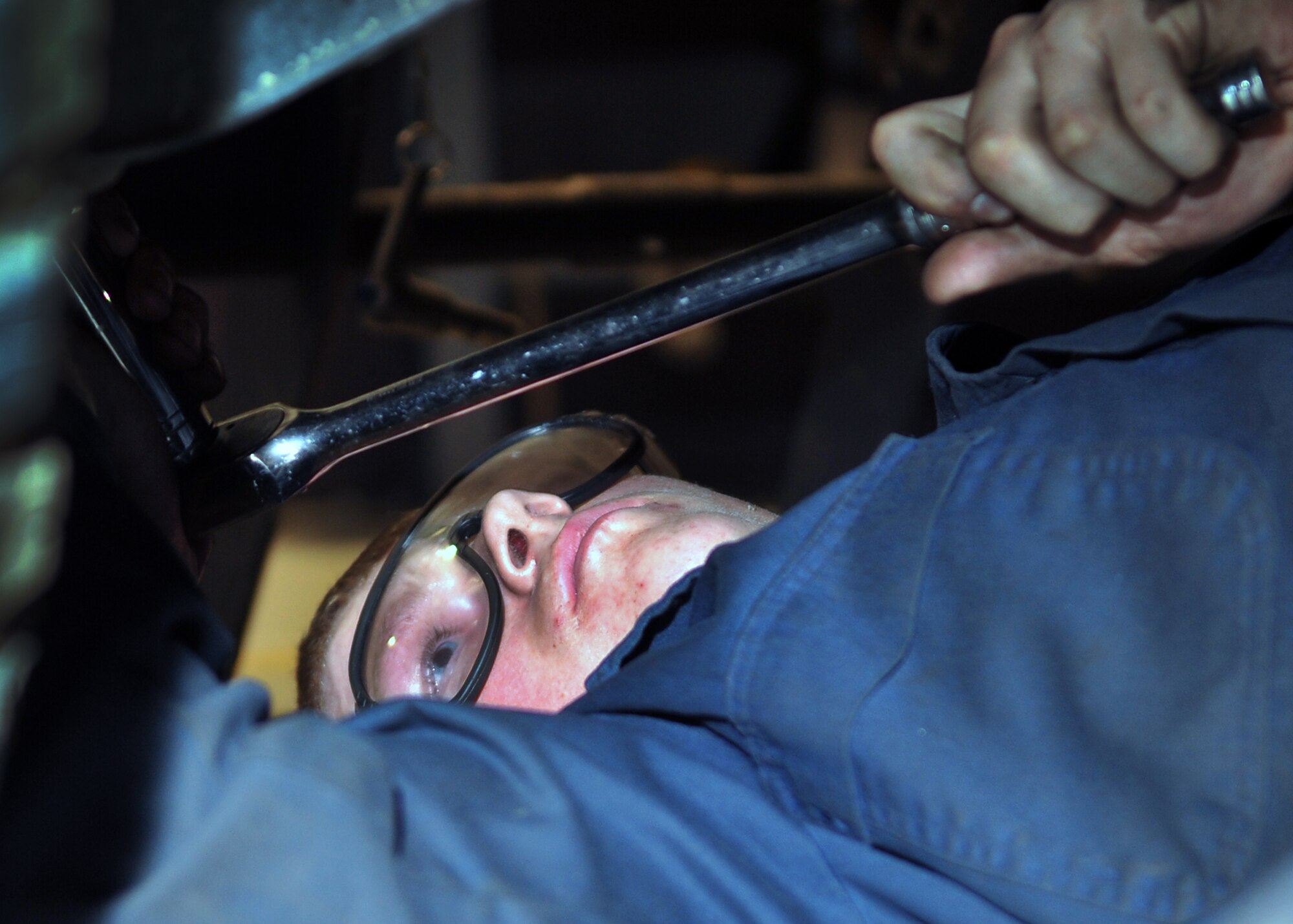 Senior Airman Brian Jordan, 51st Logistics Readiness Squadron vehicle equipment maintenance journeyman, replaces a shock absorber on a Humvee at Osan Air Base, Republic of Korea, June 6, 2012. The 51st LRS maintains approximately 1,400 vehicles on base. (U.S. Air Force photo/Staff Sgt. Craig Cisek)