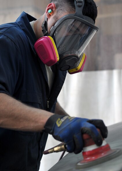 Senior Airman Michael Blair, 51st Logistics Readiness Squadron vehicle equipment maintenance journeyman, uses an orbital sander to smooth out the metal surface of a vehicle at Osan Air Base, Republic of Korea, June 6, 2012. The 51st LRS maintains approximately 1,400 vehicles on base. (U.S. Air Force photo/Staff Sgt. Craig Cisek)