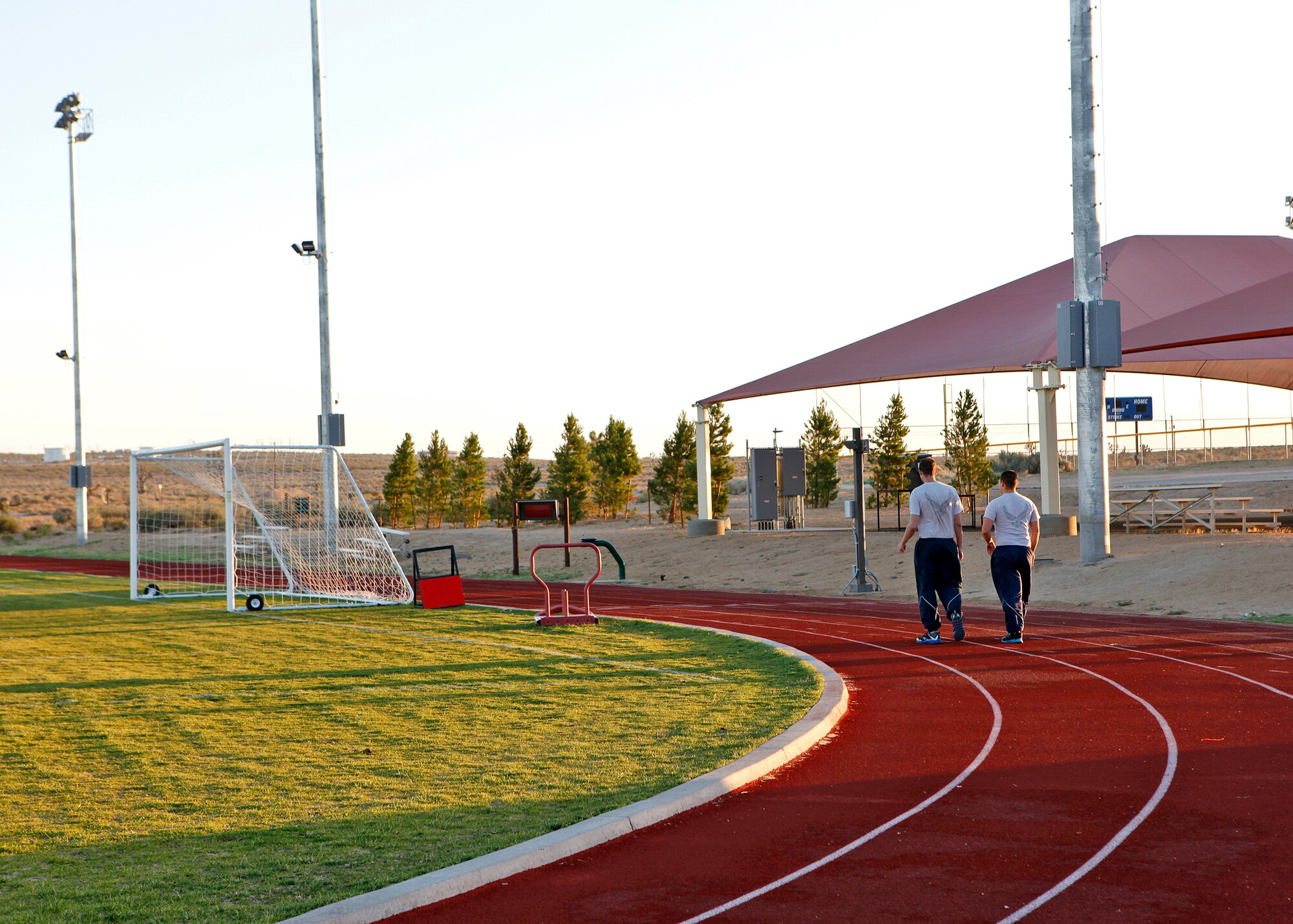 View of the resurfaced track area near the Rosburg Fitness Center. The track is just one of the many areas in the main fitness center that were upgraded as part of the final installment in a series of minor upgrades to fitness center facilities at Edwards Air Force Base, Calif. Additional upgrades included replacing the current lighting around the track to accommodate those interested in running at night. Runners will be able to turn the lights on and off themselves. A new PT pad was also installed near the track to match the layout of the existing PT area. (U.S. Air Force photo by Jet Fabara)