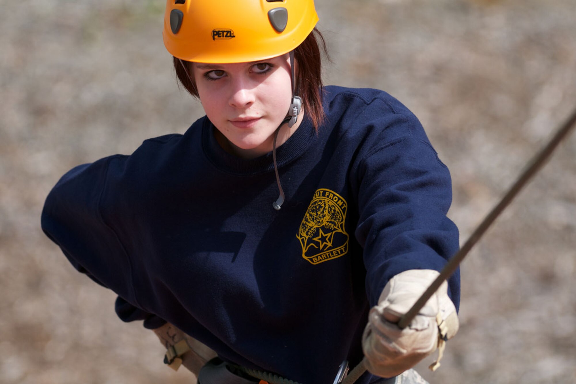 JOINT BASE ELMENDORF-RICHARDSON, Alaska -- Bartlett Junior ROTC Cadet Amber Bachtell, 13, listens to instructions while she rappels June 1 at Camp Carroll. Cadets stayed at JBER for a week during JROTC Cadet Leadership Challenge. (U.S. Air Force photo/David Bedard)