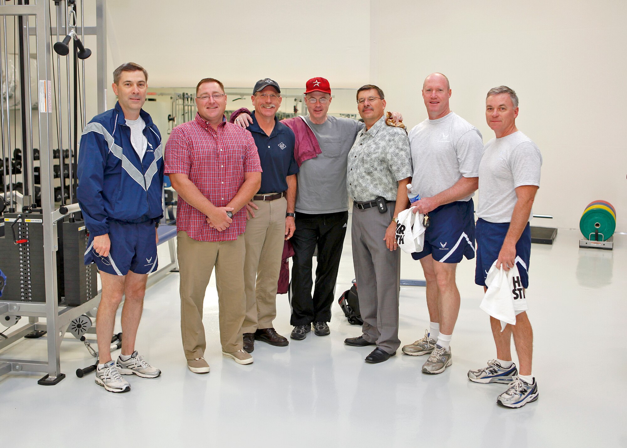 (From left to right) Col. Gregory Schwab, 95th Air Base Wing commander, Pete Smith, 95th Force Support Squadron Base Fitness and Sports Center director, Jim Longhorn, ACE Engineering construction manager, James Judkins, 95th Civil Engineer Division director, Joe Hunt, 95th Civil Engineer Division project manager, Brig. Gen. Robert C. Nolan II, Air Force Flight Test Center commander, and Col. Harry Berry, 95th Mission Support Group commander, all pose for a photo inside the new High Intensity and Free Weight workout facility after cutting the ceremonial ribbon to officially open the new area at the base gym June 4. (U.S. Air Force photo by Jet Fabara)