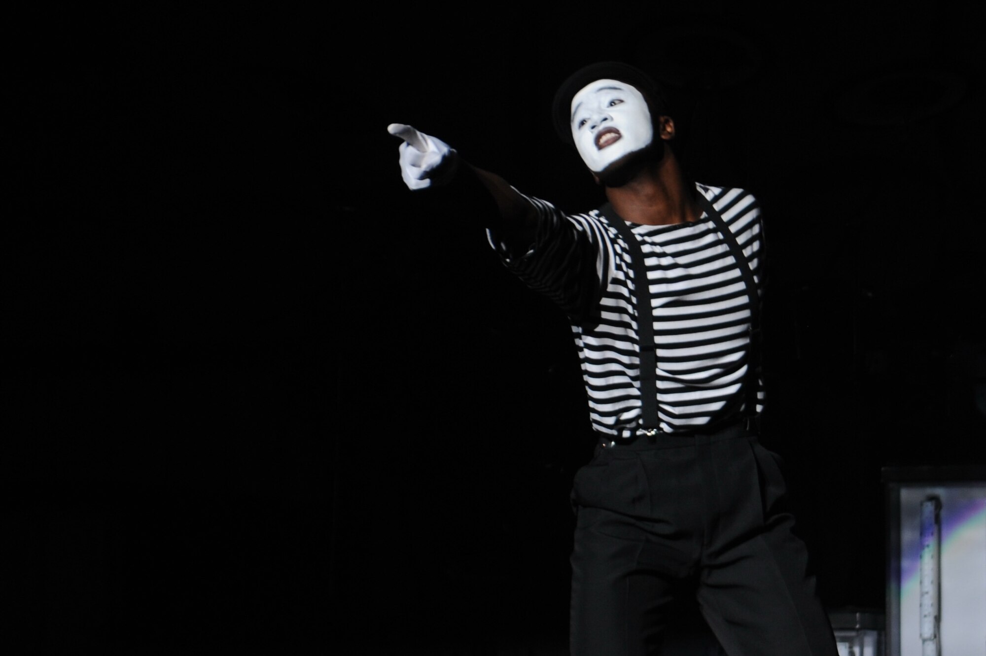 KIRTLAND AFB, N.M. – Senior Airman Charles Cooper performs a mime routine. Tops in Blue is scheduled to travel to 14 countries during their tour. (Photo by Ken Moore)