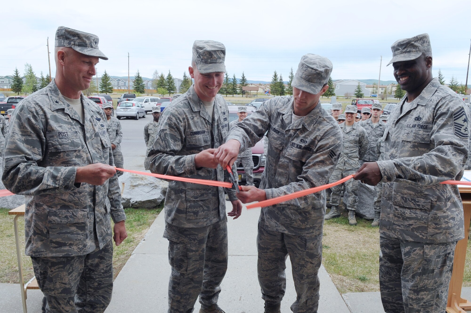 Brig. Gen. James Post, 354th Fighter Wing commander, Senior Airman Zachary
Cunningham, 354th Civil Engineer Squadron, Senior Airman Nicholas Tuck, 18th
Aggressor Squadron, and Chief Master Sgt. Jerry Moore, 354th FW command
chief, officially open the Icebox, the new Airman's center, at a ceremony
May 22.  (U.S. Air Force photo/Airman 1st Class Lauren-Taylor Garcia)
