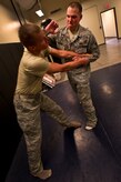 Staff Sgt. Michael Mattern, 628th Security Forces Squadron patrolman, moves to strike Airman 1st Class Michael Compson, 628th SFS patrolman, during Personal Apprehension Restraint Techniques and Mechanical Advantage Control Hold training at the combat arms building on Joint Base Charleston, S.C., June 5, 2012. The training is an annual requirement for the Airmen in case of a physical situation while on duty. (U.S. Air Force photo/Airman 1st Class George Goslin)