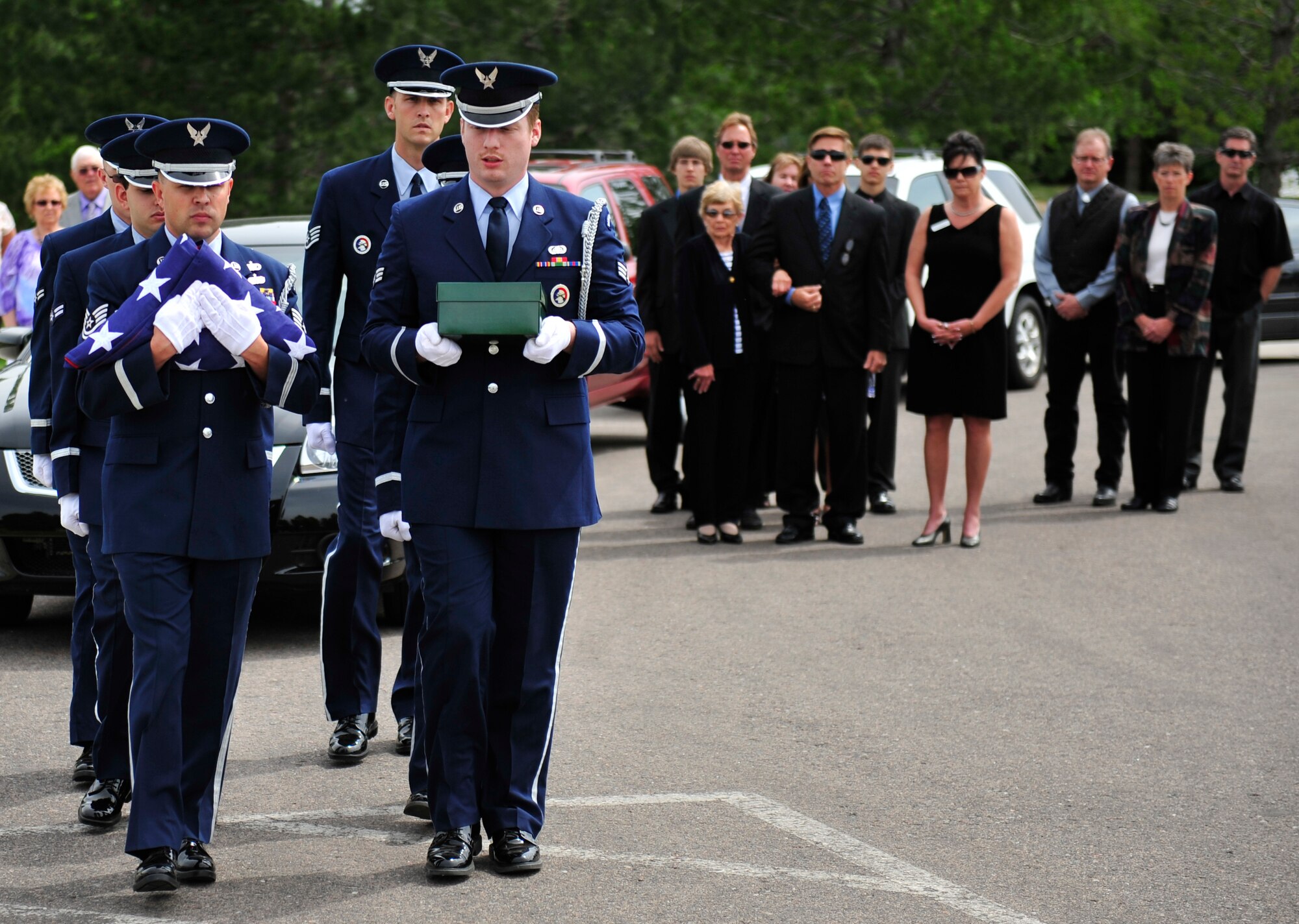 FORT LOGAN, Colo. -- The Buckley Mile High Honor Guard carries the remains of a military veteran during a ceremony June 5, 2012 at Fort Logan National Ceremony. The Mile High Honor Guard unit is an all volunteer section made up of varying Air Force career fields at Buckley. (U.S. Air Force photo by Senior Airman Paul Labbe) 
