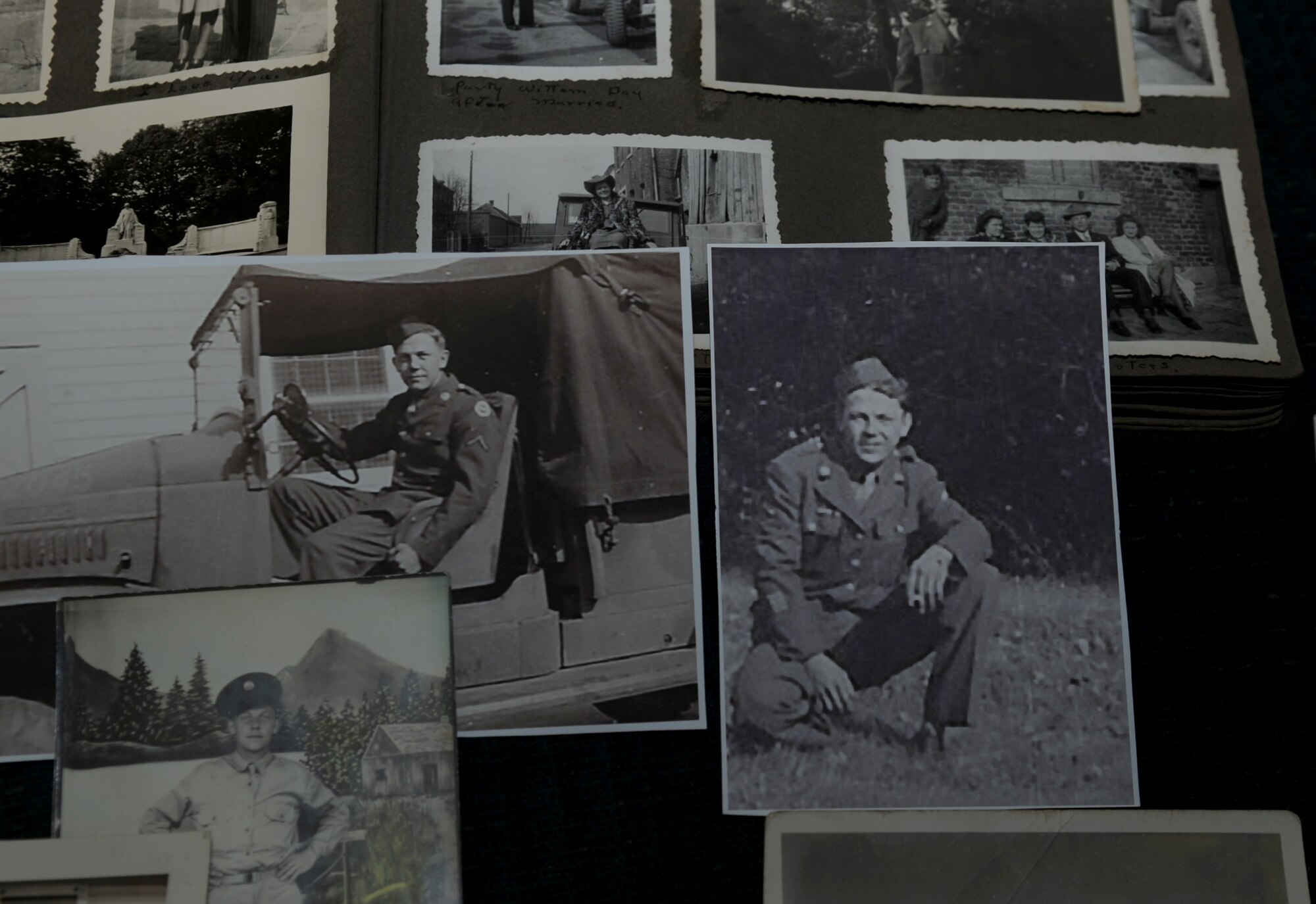 Photos of U.S. Army Pfc. John Coons sit in an arrangement at his home in Hampton, Va., June 6, 2012. Coons is a World War II veteran, two-time prisoner of war and survivor of the Battle of the Bulge. (U.S. Air Force photo by Senior Airman Jarad A. Denton/Released)