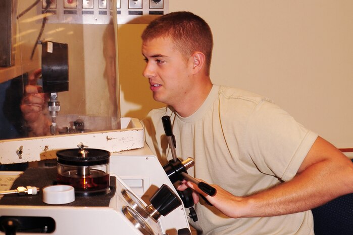 Airman 1st Class Herschell Miller, 437th Maintenance Squadron Precision Measurement Equipment Laboratory technician out of Joint Base Charleston, S.C., calibrates a tripod-jack gauge, May 29, 2012.  PMEL Airmen perform and manage repair, calibration of test, measurement and diagnostic equipment. (U.S. Air Force photo/ Airman 1st Class Chacarra Walker)