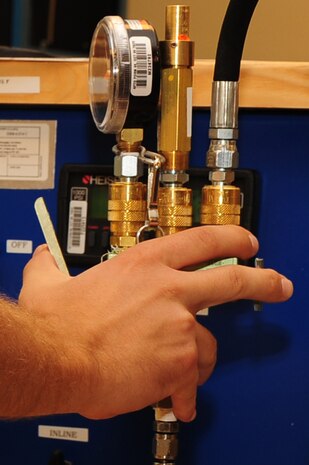 Airman 1st Class Herschell Miller, 437th Maintenance Squadron Precision Measurement Equipment Laboratory technician out of Joint Base Charleston, S.C., calibrates a dial caliper May 29, 2012.  (U.S. Air Force photo/ Airman 1st Class Chacarra Walker)